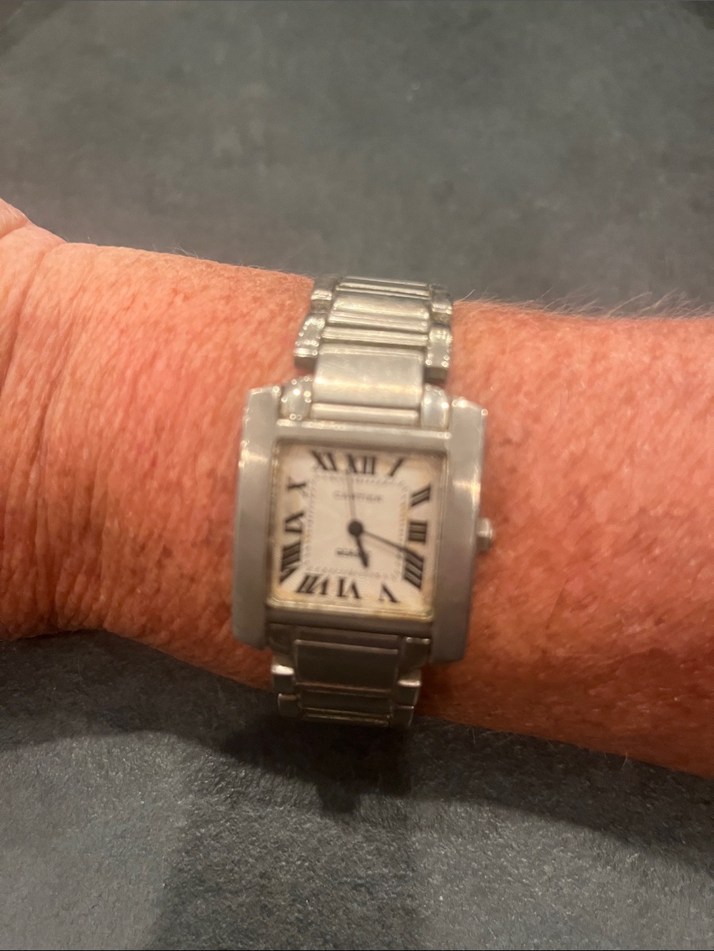 Inspired silver tone men’s tank watch.
